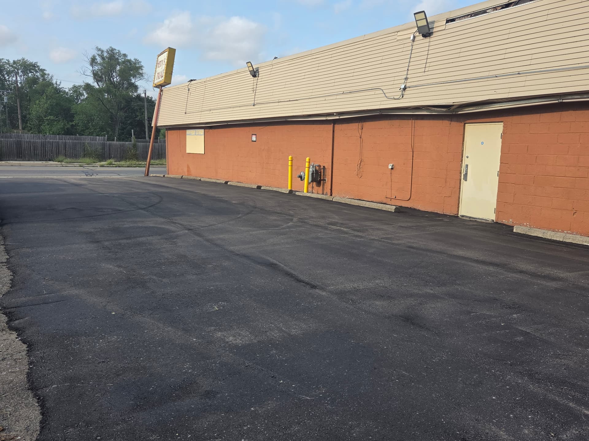 Sealcoated parking lot at a Metro Detroit venue before line striping